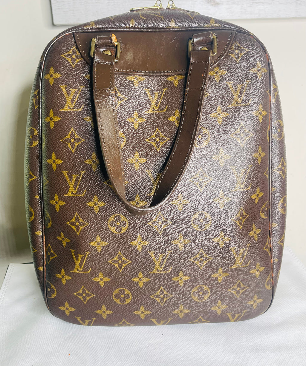 LOUIS VUITTON Monogram Excursion Hand Bag