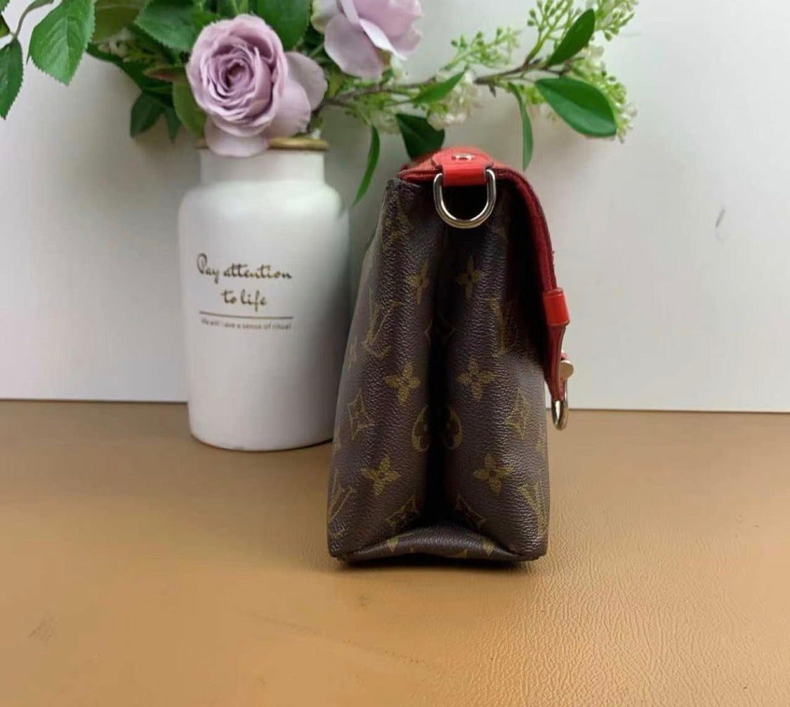 Louis Vuitton
Saint Michel Handbag Monogram Canvas and Epi Leather