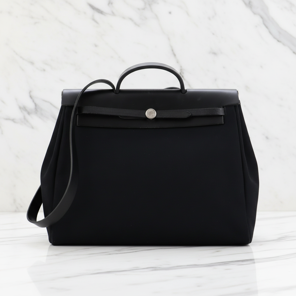 Hermes
Herbag Toile and Leather MM Shoulder Bag