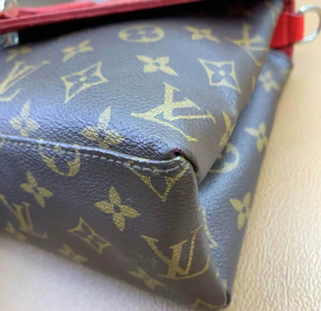 Louis Vuitton
Saint Michel Handbag Monogram Canvas and Epi Leather