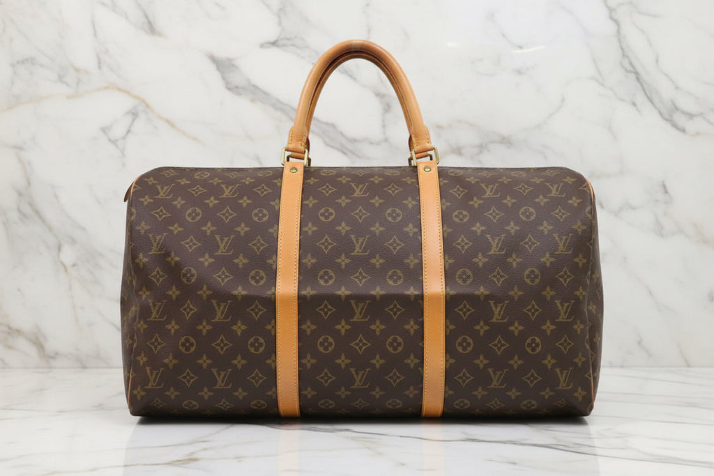 LOUIS VUITTON
Keepall 55 Monogram Canvas Travel Bag Brown