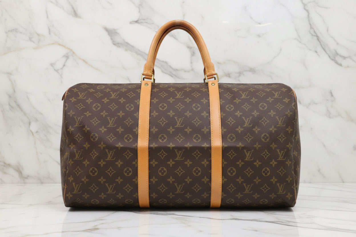 LOUIS VUITTON
Keepall 55 Monogram Canvas Travel Bag Brown