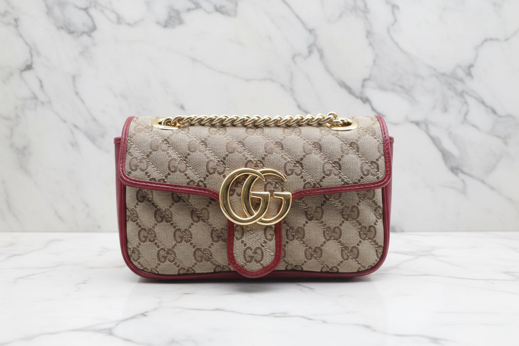 GUCCI Small GG Marmont Matelassé Diagonal GG Canvas and Leather shoulder bag.