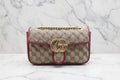 GUCCI Small GG Marmont Matelassé Diagonal GG Canvas and Leather shoulder bag.