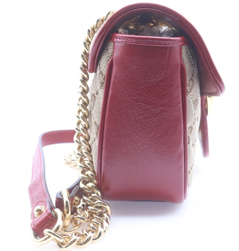 GUCCI Small GG Marmont Matelassé Diagonal GG Canvas and Leather shoulder bag.